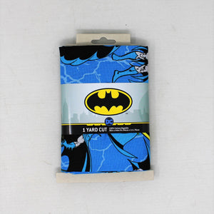 Group swatch 1 Yard Pre-Cut Batman Fabrics in packaging on white background