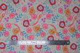 Flat swatch shell fabric (pale grey beige fabric with brightly coloured tossed floral, greenery, leaves, dots, and birds in cartoon/drawing style in orange, pink, red, blue, purple, gold, grey)