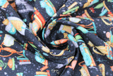 Swirled swatch Bookshelf Kitties Black fabric (black fabric with busy tossed cartoon style kitties in various colours with book stacks)