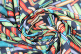 Swirled swatch Books Black fabric (black fabric with tossed books/book bindings allover in various colours and styles)