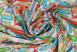 Swirled swatch Books White fabric (white fabric with tossed books/book bindings allover in various colours and styles)