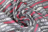 Swirled swatch man cave themed fabric in grey text (dark grey fabric with white/light grey/red writing man cave phrases ex: "NO WORKING" "All day Gaming" etc.)