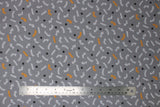 Flat swatch Puuur fabric (grey fabric with tossed white and yellow cursive writing "play" "purrr" "kitty" etc and tossed black paw prints)