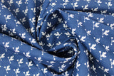 Swirled swatch break of day fabric (dark blue fabric with tiny white repeated pattern allover chicken sitting on single weather vane arrow)