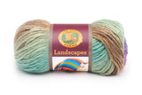 A ball of Lion Brand Landscapes yarn on white background in colourway cabana (pale light green, pale light teal, pale burnt orange, purple)