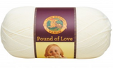 A ball of Lion Brand Pound of Love yarn on white background in shade antique white (off white)