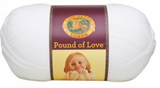 A ball of Lion Brand Pound of Love yarn on white background in shade white