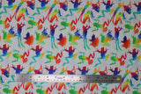 Flat swatch Rainbow Frogs fabric (white fabric with tossed frog silhouettes allover in various poses with multi-coloured rainbow within)