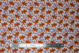 Flat swatch Gingerbread fabric (white and light blue subtle marbled look fabric with tossed gingerbread cats making snow angels and tossed red and white candies, red paw prints, fish bones)