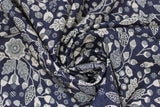Swirled swatch blooming nightfall fabric (black fabric with beige floral outlines and shapes allover with black details within, floral heads, leaves, fruit, etc.)