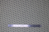 Flat swatch blossoming linen fabric (off white fabric with small black floral head outlines with tiny leaves around allover)