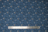 Flat swatch Trees fabric (medium faded blue fabric with long thin black tree branches allover in long stripes with tossed white glowing moons in various phases)