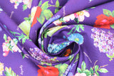Swirled swatch purple bouquets (dark purple fabric with full colour small bouquets of floral allover with small light purple cursive labels)