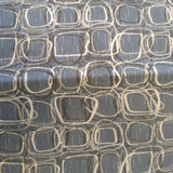 Square swatch upholstery fabric with tiled doodle circles and square print pattern allover (faded blue fabric with brown and beige pattern)