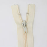 35cm medium light weight one way separating sportswear zipper in cream half zipped