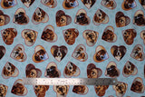 Flat swatch Hearts fabric (pale blue fabric with paw prints in background and tossed heart badges allover with dog faces within)