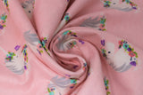 Swirled swatch unicorns pink fabric (baby pink fabric with medium sized white unicorn heads with grey manes, pink purple and blue decorative floral with greenery)