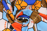 Swirled swatch all star sports cotton flannel (hexagon tiled fabric with cartoon style sports ball graphics within: football, basketball, soccer ball, baseball, and coloured hexagons in between: white, light and dark blue, red)