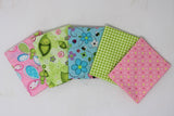 Fanned 5pc precuts in style "Sweet Pea" (pink with blue and green butterflies, green with happy pea pods and white floral, blue with tossed floral and insects, green and white gingham, pink with yellow and pink polka dots)