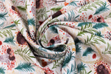 Swirled swatch cream fabric (cream fabric with busy tossed forest scene and emblems allover in illustrative style: green trees, beige paths, falling autumn coloured leaves, sleeping snuggly bears and hedgehogs, etc.)