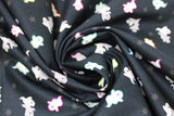 Swirled swatch Black fabric (black fabric with small tossed white and grey ghosts allover with different coloured outlines, faint grey stars)