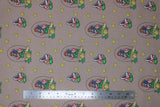 Flat swatch Super Mario Bros (licensed) print fabric in Lucky Mario (Mario and piranha badge "lucky" text, stars on grey/taupe) 