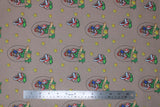 Flat swatch Super Mario Bros (licensed) print fabric in Lucky Mario (Mario and piranha badge "lucky" text, stars on grey/taupe)