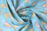 Swirled swatch white woodland fabric (pale blue fabric with tossed woodland creatures, owls, racoons, bunnies, foxes and white snowflakes allover)