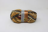 Small ball of bulky yarn in mesa print (beige, tan, white, black, mustard, rust colourway)