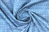 Swirled swatch home of the free fabric (pale medium blue marbled look fabric with small and medium blue stars allover in stripes)