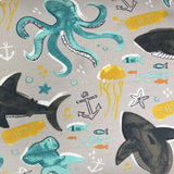 Square swatch knit material in deep sea life grey (doodled sharks, octopi, fish, and jellyfish with nautical emblems on grey)