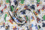 Swirled swatch Marvel (licensed) fabric in Kapow (cartoon avengers fighting/punching on white)