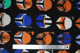 Flat swatch assorted helmets star wars fleece (black fabric with lines of helmets in white, orange, blue of boba fett, the mandalorian, etc.)