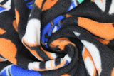 Swirled swatch assorted helmets star wars fleece (black fabric with lines of helmets in white, orange, blue of boba fett, the mandalorian, etc.)