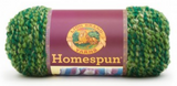 A ball of Lion Brand Homespun in a boucle texture and colourway Forest (forest green and spring green with light yellow)
