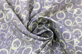 Swirled swatch Stone Bikes fabric (washed look grey fabric with tossed neutral bike shapes allover)