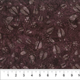 Tossed Animal Footprints Burgundy fabric swatch (dark burgundy/brown marbled look fabric with tossed animal footprints in various styles allover in pale brown/grey shades)