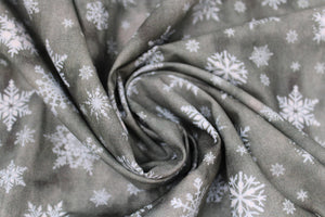 Group swatch of snowflake printed fabric in a variety of colours
