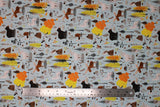 Flat swatch Canadian Boreal fabric (pale blue fabric with busy tossed cartoon style Canadian related fall themed emblems allover: trees, leaves, bears, moose, beavers, wolves, owls, sprigs, acorns, etc.)