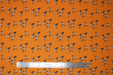 Flat swatch Canadian Geese fabric (golden orange fabric with small Canadian geese in flight allover)