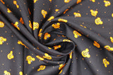 Swirled swatch spooky ears fabric (black fabric with small tossed orange mickey head look jack-o-lanterns tossed allover with tiny orange polka dots)