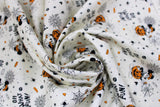 Swirled swatch Pumpkin Mickey fabric (white fabric with tossed halloween related cartoon emblems and mickey mouse characters)