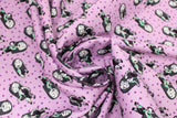 Swirled swatch Sally Dot fabric (mauve fabric with dots allover and tossed sally character in black and grey allover)