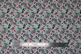 Flat swatch Pattern Play fabric (white fabric with tossed movie emblems in full colour allover)