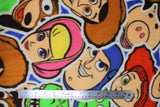 Flat swatch Toy Story Sticker Party fabric (large collaged characters with white thick edging sticker look)