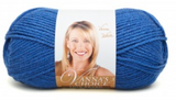 A ball of Lion Brand Vanna's Choice yarn on white background in shade colonial blue (bright medium blue)