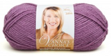 A ball of Lion Brand Vanna's Choice yarn on white background in shade dusty purple (pale medium purple)