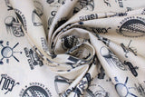 Swirled swatch Golf 3 fabric (pale tan fabric with tossed black related golf text and emblems allover)