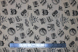 Flat swatch Golf 3 fabric (pale tan fabric with tossed black related golf text and emblems allover)