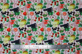 Flat swatch Griotte Multi fabric (white fabric with tossed full colour fruits and red/brown cursive text)